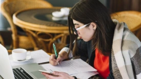 A woman studying online